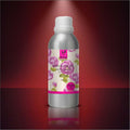 Veena Rose Premium Vaporizer and Diffuser Oil 100ml bottle displayed centered against a deep red dramatic studio backdrop.