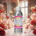 Veena Rose Vaporizer and Diffuser Oil 100ml bottle standing proudly in a majestic room filled with red and pink rose bouquets.