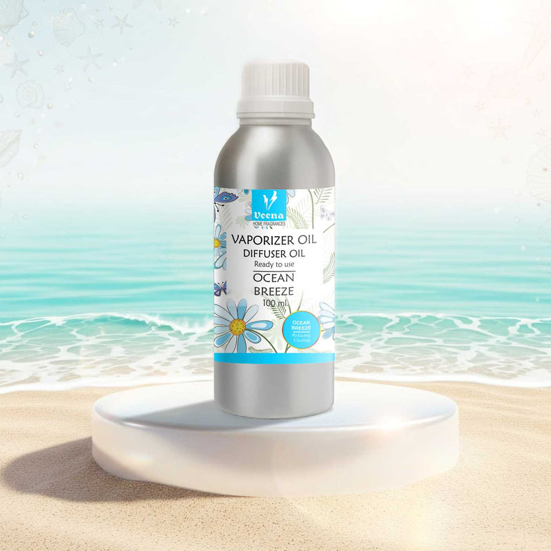 Veena Ocean Breeze Premium Vaporizer and Diffuser Oil 100ml canister resting on an elegant white podium with clear crashing ocean waves background.