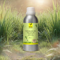 Veena Lemongrass Premium Vaporizer and Diffuser Oil 100ml bottle standing inside a field of lush tall green grass under bright sunshine.