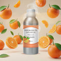 Veena Mandarin Vaporizer and Diffuser Oil 100ml bottle surrounded by floating fresh mandarin oranges and citrus slices.