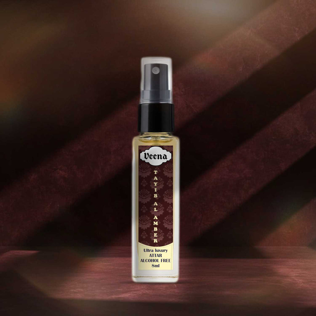 Veena Tayib Al Amber traditional rich balsamic perfume spray bottle highlighted on a deep burgundy textured background.