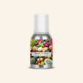 Veena Tropical Fruit Pure Perfume Concentrate bottle with a rich, colorful label collage featuring pineapple, melon, kiwi, dragon fruit, and berries.