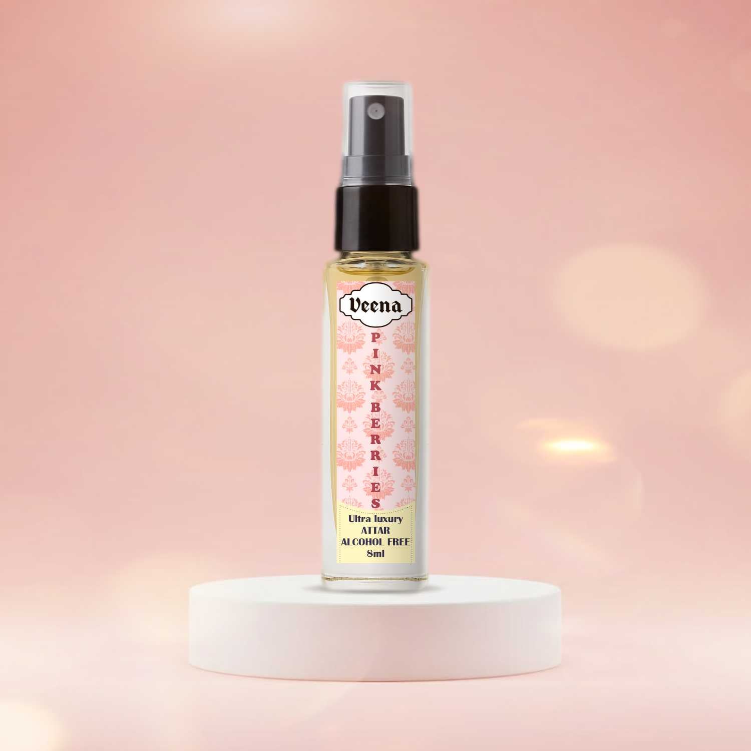 Veena Pink Berries luxury fine-mist 8ml attar spray vial standing gracefully on a minimalist matte white circular block podium with a soft pastel pink bokeh light background.