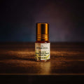 Veena luxury non-alcoholic Attar Full jasmine perfume oil roll-on bottle highlighted on a rich dark textured studio surface.