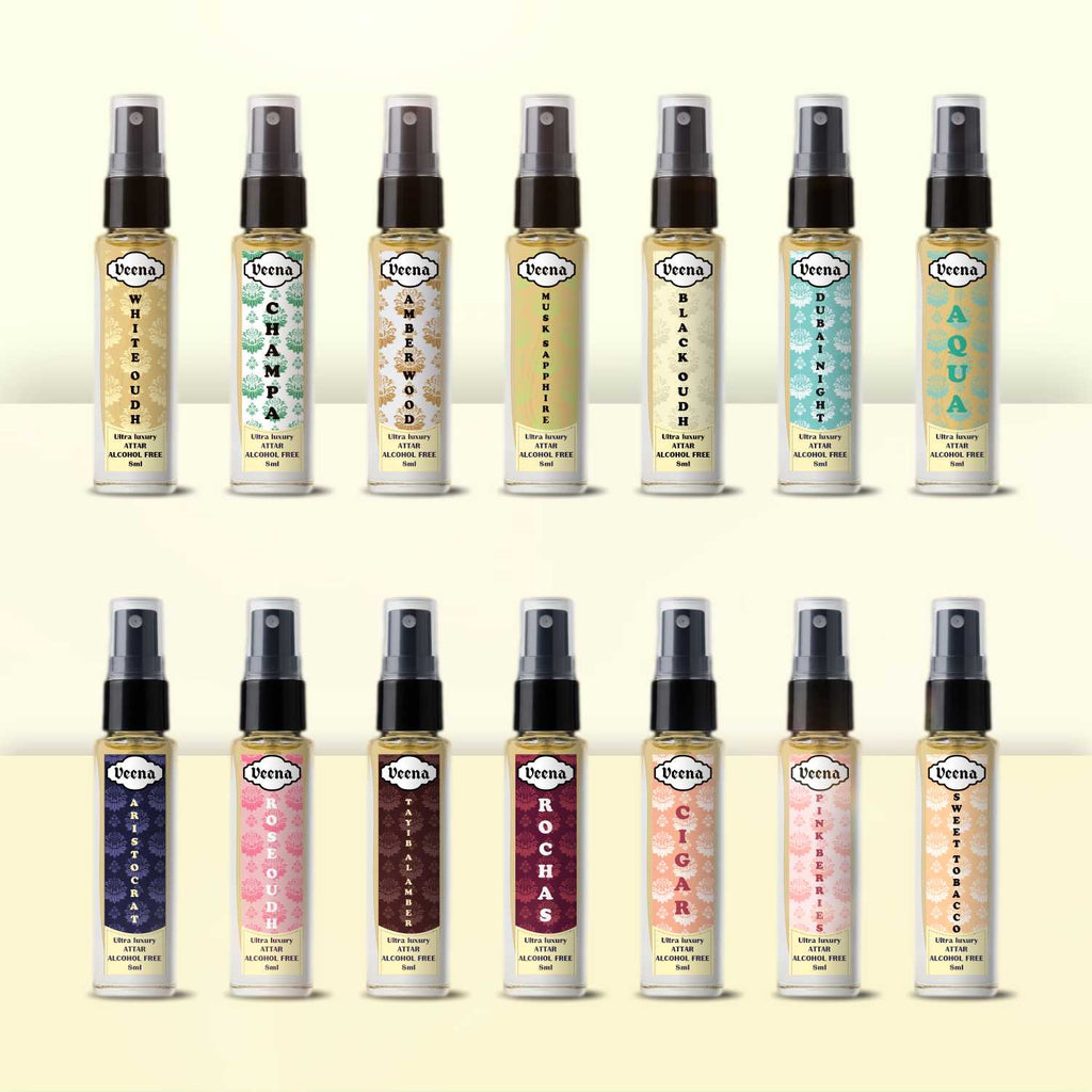 Veena Ultra Luxury Attar Intense Spray Set showcasing a comprehensive collection of fourteen individual 8ml perfume bottles lined up in two elegant rows.