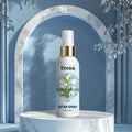Veena Rajnigandha premium attar spray 100ml bottle with a gold collar displayed on a white marble podium within a majestic blue architectural arch background.
