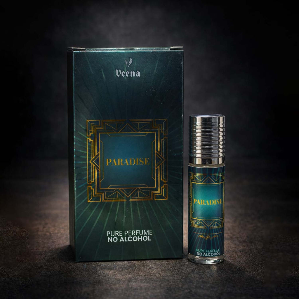 Veena luxury Paradise perfume oil pocket roll-on standing next to its premium emerald green and gold Art Deco presentation box.