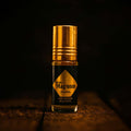 Veena Magnum Series Original pure perfume pocket-sized roll-on bottle with an opulent gold cap displayed under rich cinematic spotlighting.