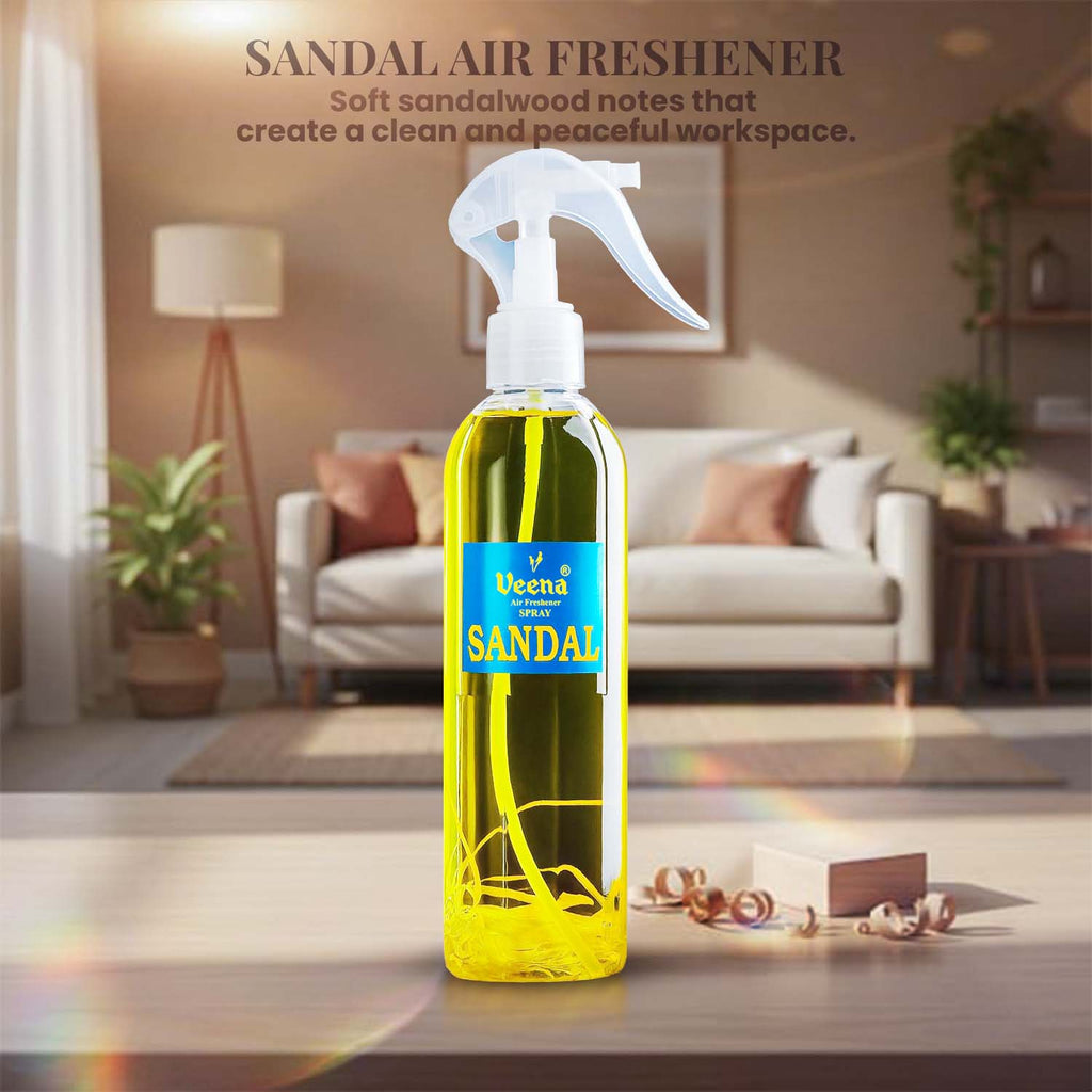Veena Rajnigandha premium room freshener spray bottle displayed elegantly on a wooden surface with a soft indoor houseplant background.