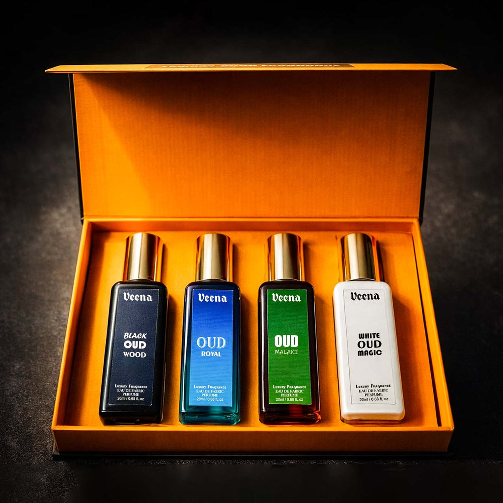Inside look of Veena premium rigid yellow gift box featuring four premium Oud perfume bottles with gold caps.