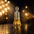 Veena Royal Series Ombre Leather pure perfume concentrate bottle highlighted under luxury golden cinematic lighting.