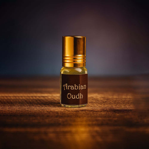 Veena luxury non-alcoholic Arabian Oudh perfume oil bottle highlighted on a rich dark textured studio surface.