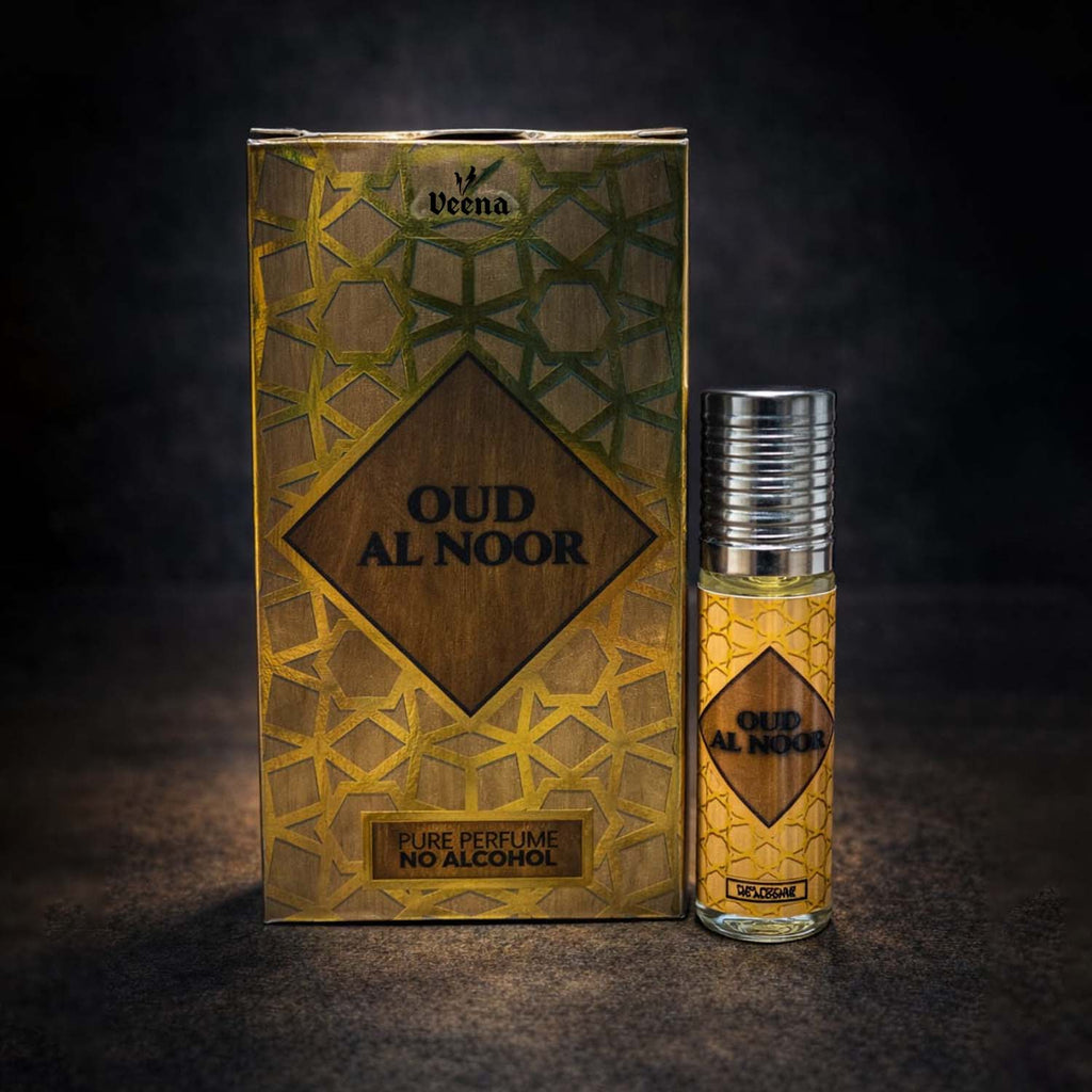 Veena luxury Oud Al Noor perfume oil pocket roll-on standing next to its premium gold and bronze mosaic presentation box.
