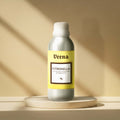 Veena Citronella Premium Anti-Mosquito Repellent Fragrance Oil aluminum bottle on a minimalist round display podium.