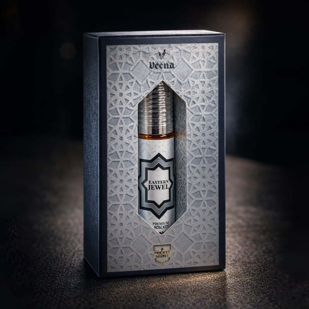 Veena concentrated Eastern Jewel attar roll-on bottle nested perfectly inside its custom diamond-window presentation gift box.