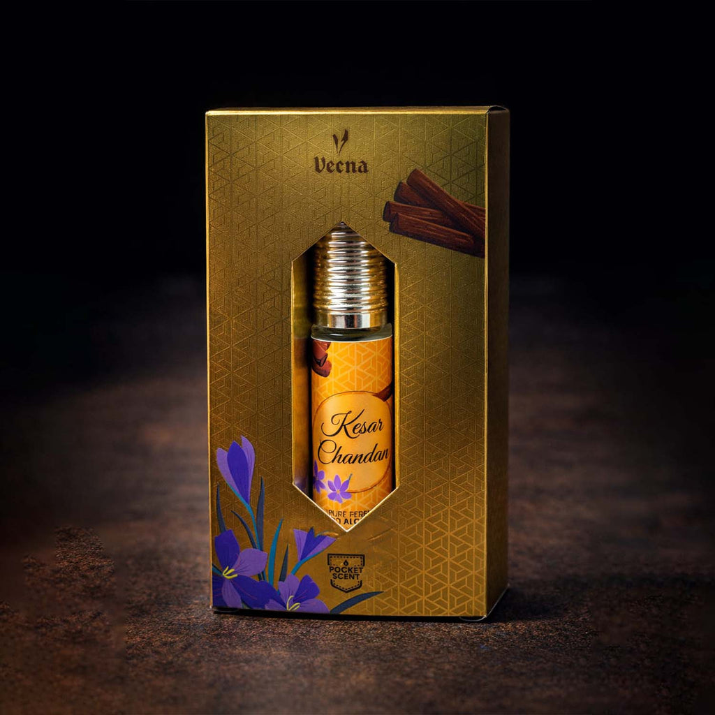 Veena concentrated Kesar Chandan attar roll-on bottle nested perfectly inside its custom diamond-window presentation gift box.