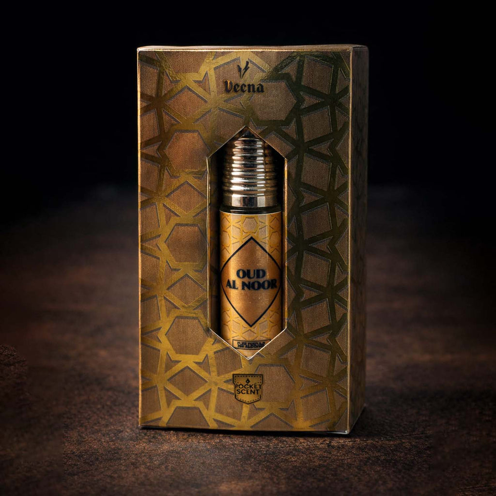 Veena concentrated Oud Al Noor attar roll-on bottle nested perfectly inside its custom diamond-window presentation gift box.