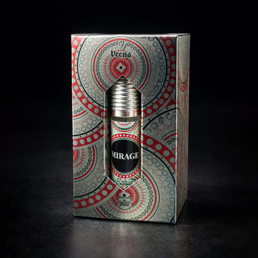 Veena concentrated Mirage attar roll-on bottle nested perfectly inside its custom diamond-window presentation gift box.