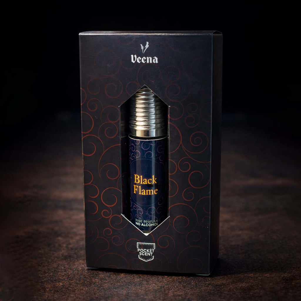 Veena concentrated Black Flame attar roll-on bottle nested perfectly inside its custom diamond-window presentation gift box.