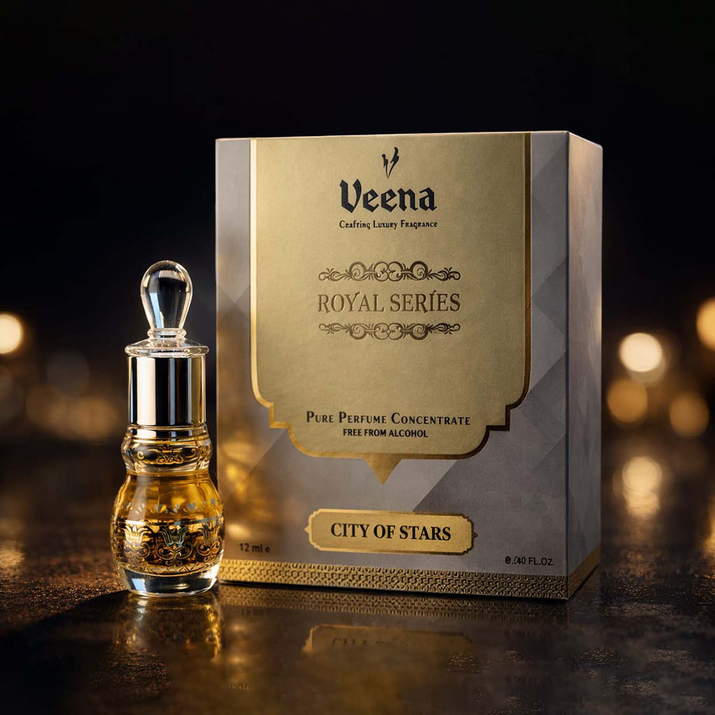 Veena City of Stars luxury non-alcoholic perfume oil decanter standing elegantly next to its gold and grey presentation box.