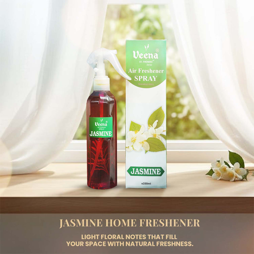 Veena luxury Jasmine air freshener 250ml spray bottle standing next to its premium white and green presentation box on a bright windowsill.