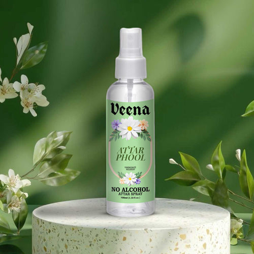 Veena premium multi-floral Attar Phool non-alcoholic perfume bottle showcased on a stone terrazzo pedestal.