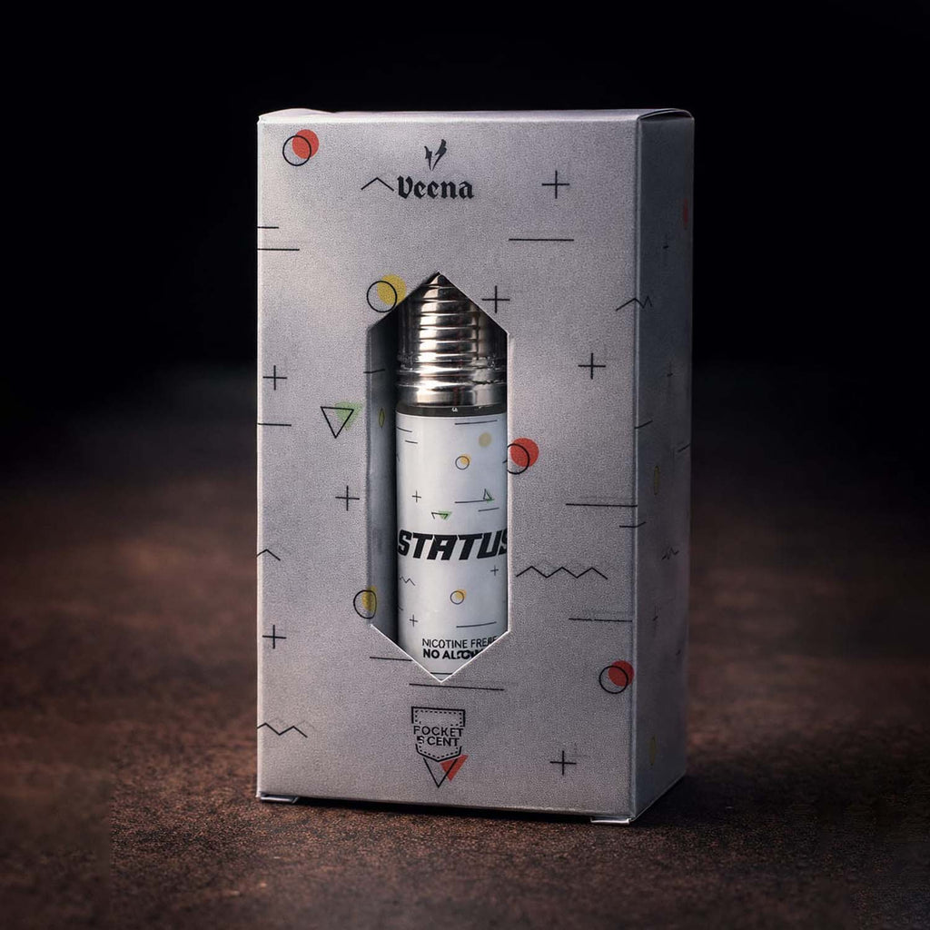 Veena concentrated Status attar roll-on bottle nested perfectly inside a custom diamond-cut silver presentation gift box.