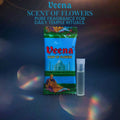 Veena Scent of Flowers premium floral fragrance packet alongside an airtight glass vial, featured under warm artistic lighting for daily temple rituals.