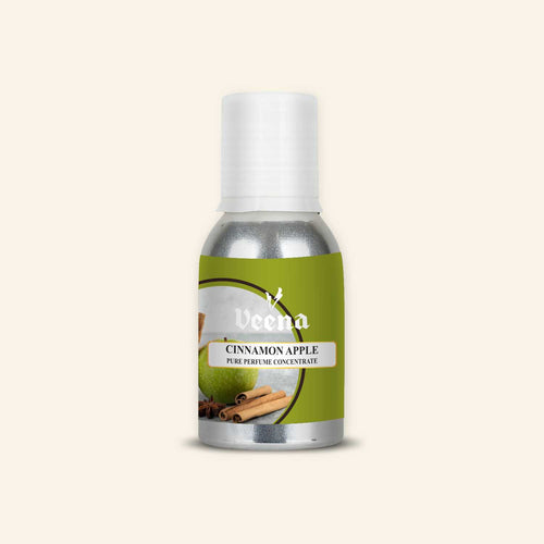 Veena Cinnamon Apple Pure Perfume Concentrate aluminum bottle with a green apple, cinnamon sticks, and star anise illustration label design.