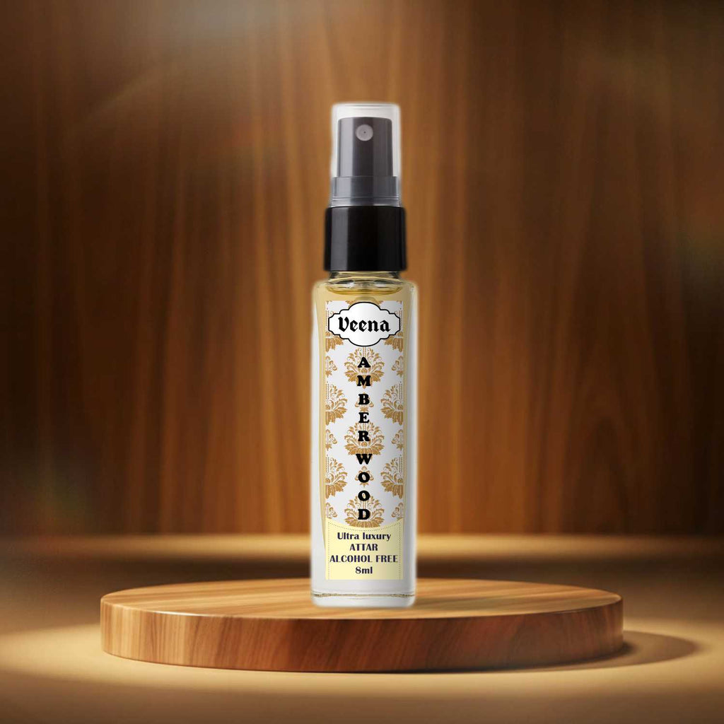 Veena Amber Wood luxury concentrated perfume spray bottle showcased on a round wooden block with rich gold lighting effects.