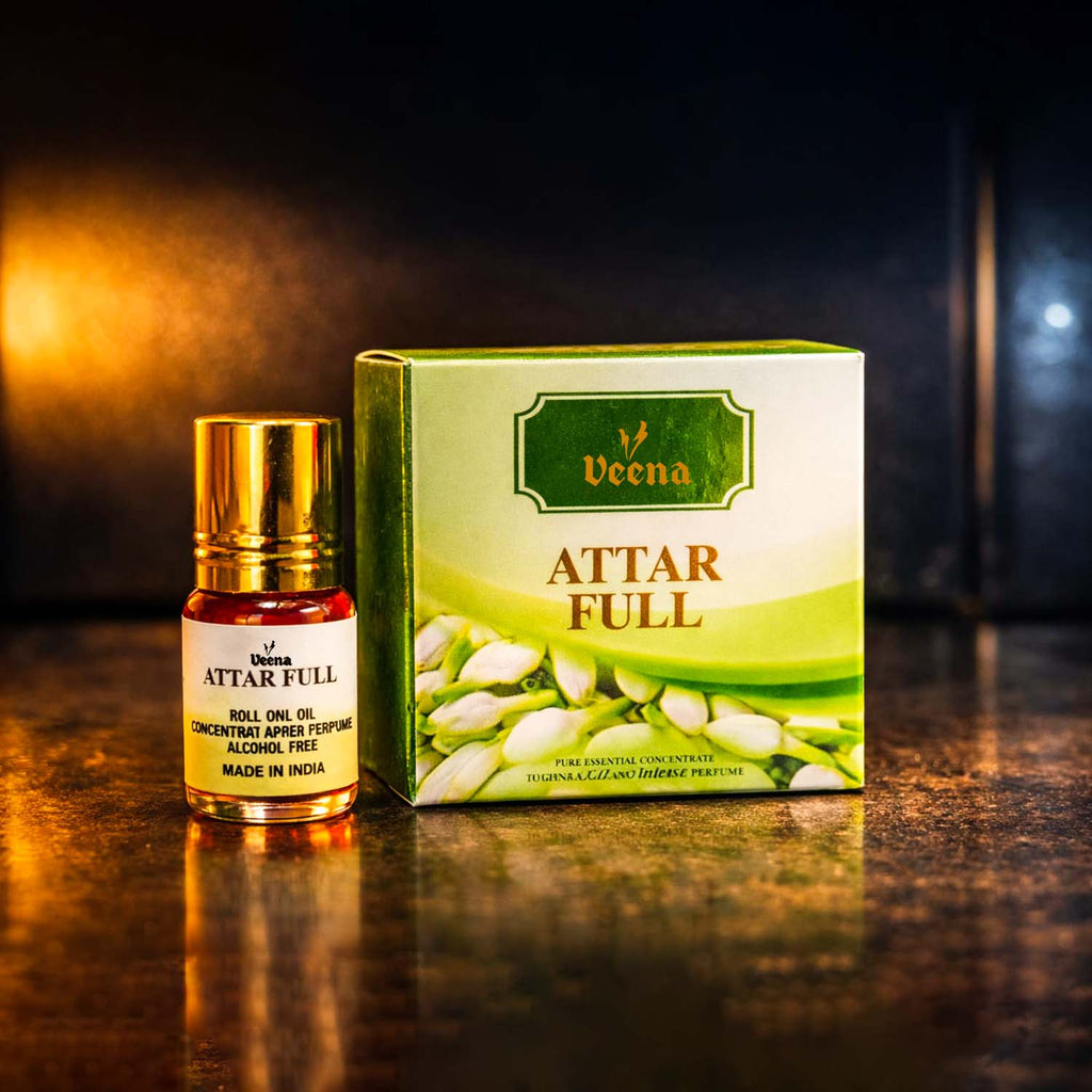 Veena Attar Full premium concentrated jasmine perfume roll-on bottle standing next to its luxury green presentation gift box.