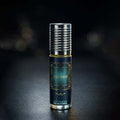 Veena Paradise premium non-alcoholic perfume oil roll-on bottle with a textured silver cap resting against a dark bokeh background.