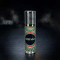 Veena Mirage premium non-alcoholic perfume oil roll-on bottle with a red and green circular mandala print label and ribbed silver cap against a dark bokeh background.