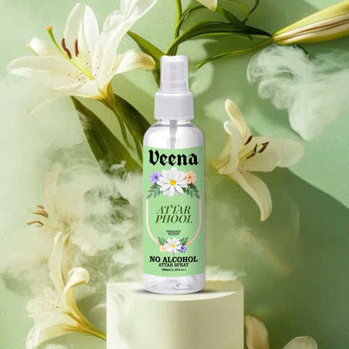 Veena Attar Phool alcohol-free spray 100ml bottle on a podium surrounded by white lilies and cinematic soft smoke.