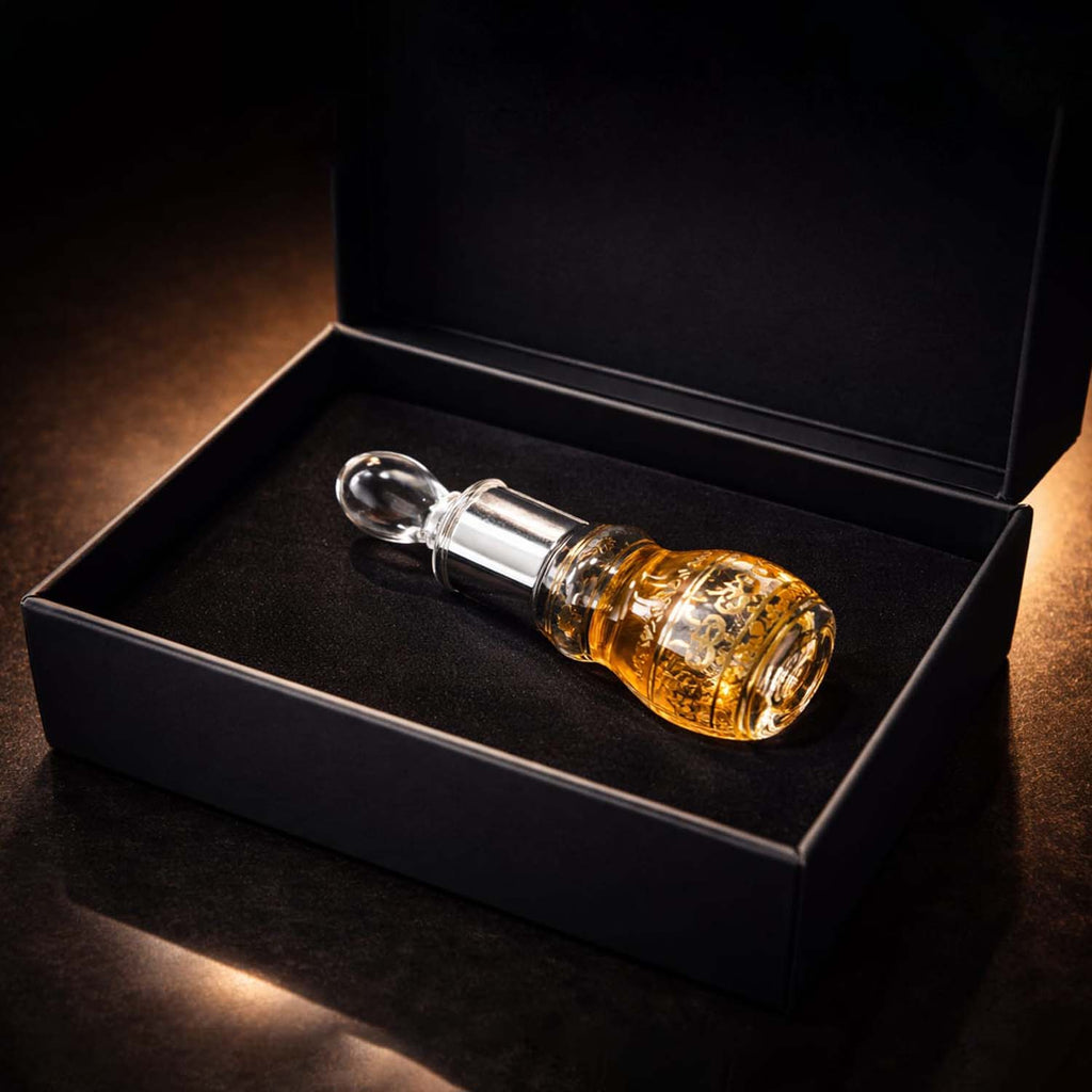 Veena premium 12ml concentrated leather attar glass bottle resting inside an ultra-luxury matte black velvet-lined gift box.