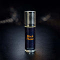 Veena Black Flame premium non-alcoholic perfume oil roll-on bottle with a dark orange spiral print label and ribbed silver cap against a dark bokeh background.