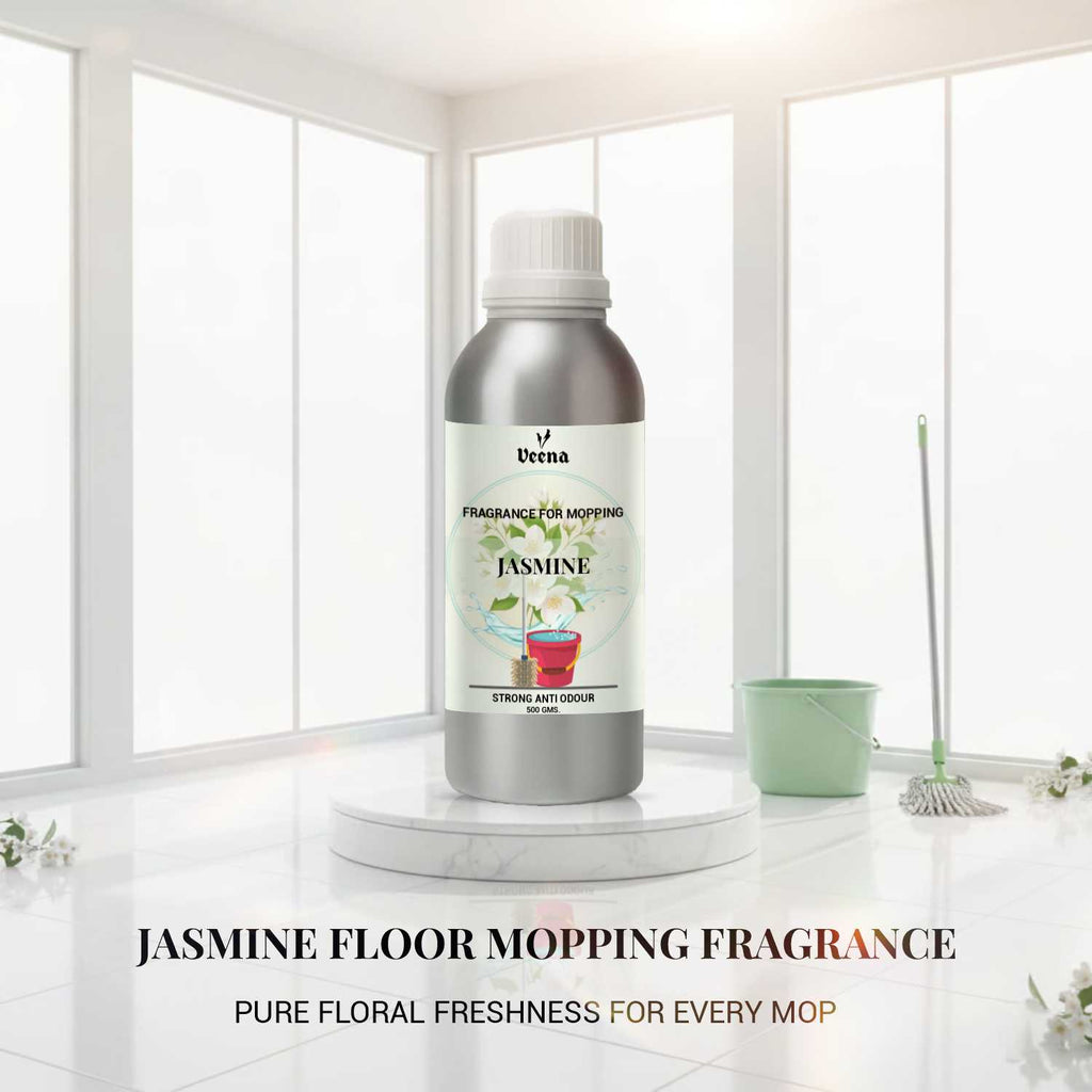 Veena Jasmine Floor Mopping Fragrance 500g aluminum bottle placed on a marble step with a white floor mop and bucket.