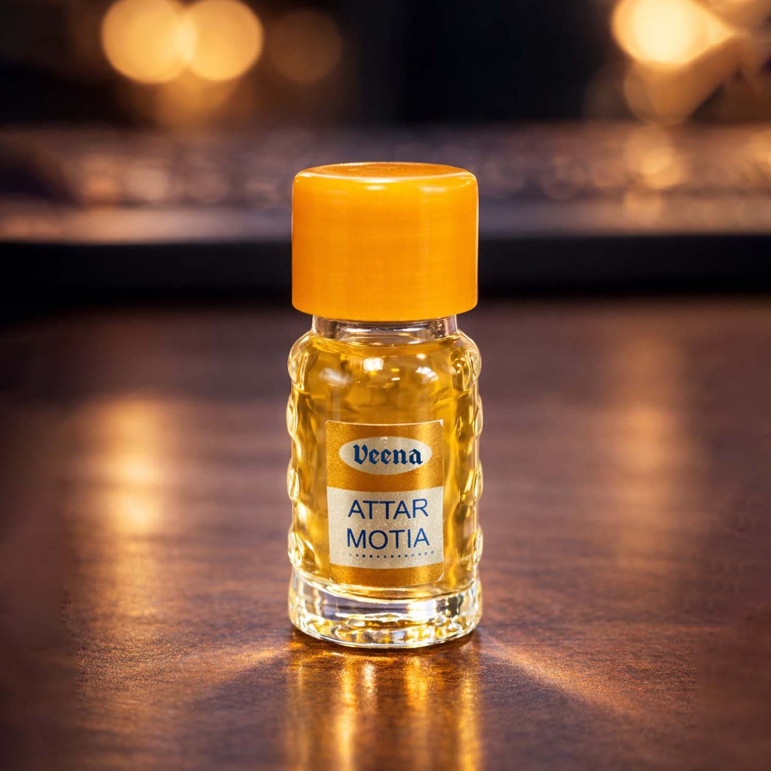Veena Attar Motia pure non-alcoholic floral fragrance oil vial displayed under a warm, luxury cinematic spotlight.