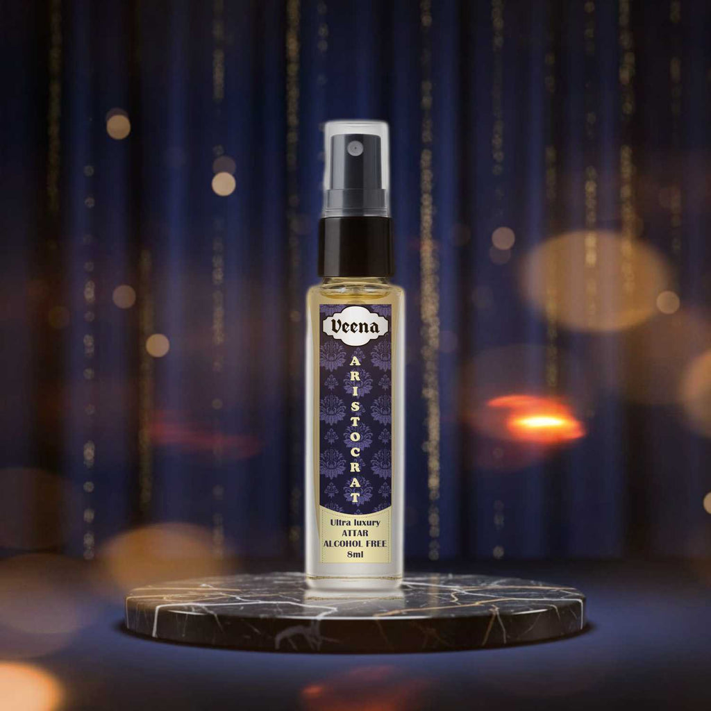 Veena Aristocrat majestic formal attar spray bottle showcased elegantly on a dark black marble stone slice base with luxury deep blue velvet backgrounds.