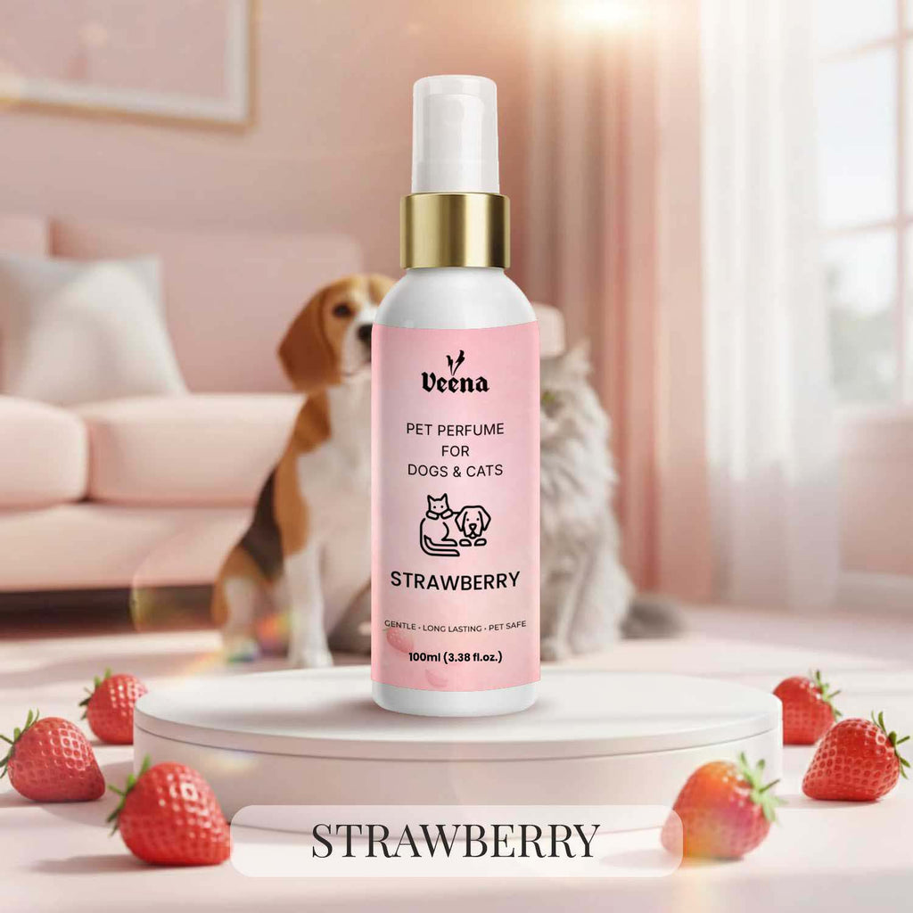 Veena Strawberry Pet Perfume for Dogs and Cats 100ml spray bottle showcased on a white pedestal surrounded by fresh red strawberries, featuring a fluffy cat and Beagle dog background.