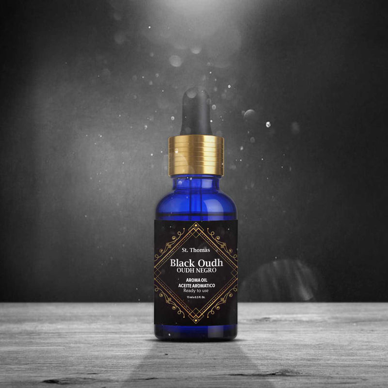 St. Thomas Black Oudh Oudh Negro Aroma Oil 15ml bottle on a rustic wooden table with an elegant dark studio background and dramatic lighting effects.