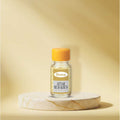 Veena Premium Attar Ruh Khus 2ml concentrated apparel perfume bottle on a luxury marble pedestal backdrop.