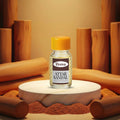 Veena Premium Attar Sandal 2ml miniature glass bottle standing on marble podium with wooden pillars background