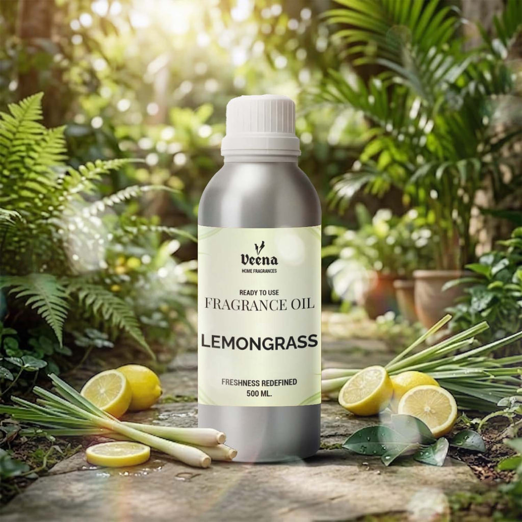 Veena Home Fragrances 500ml Lemongrass Fragrance Oil aluminum bottle on a garden pathway surrounded by fresh lemongrass stalks and sliced lemons.
