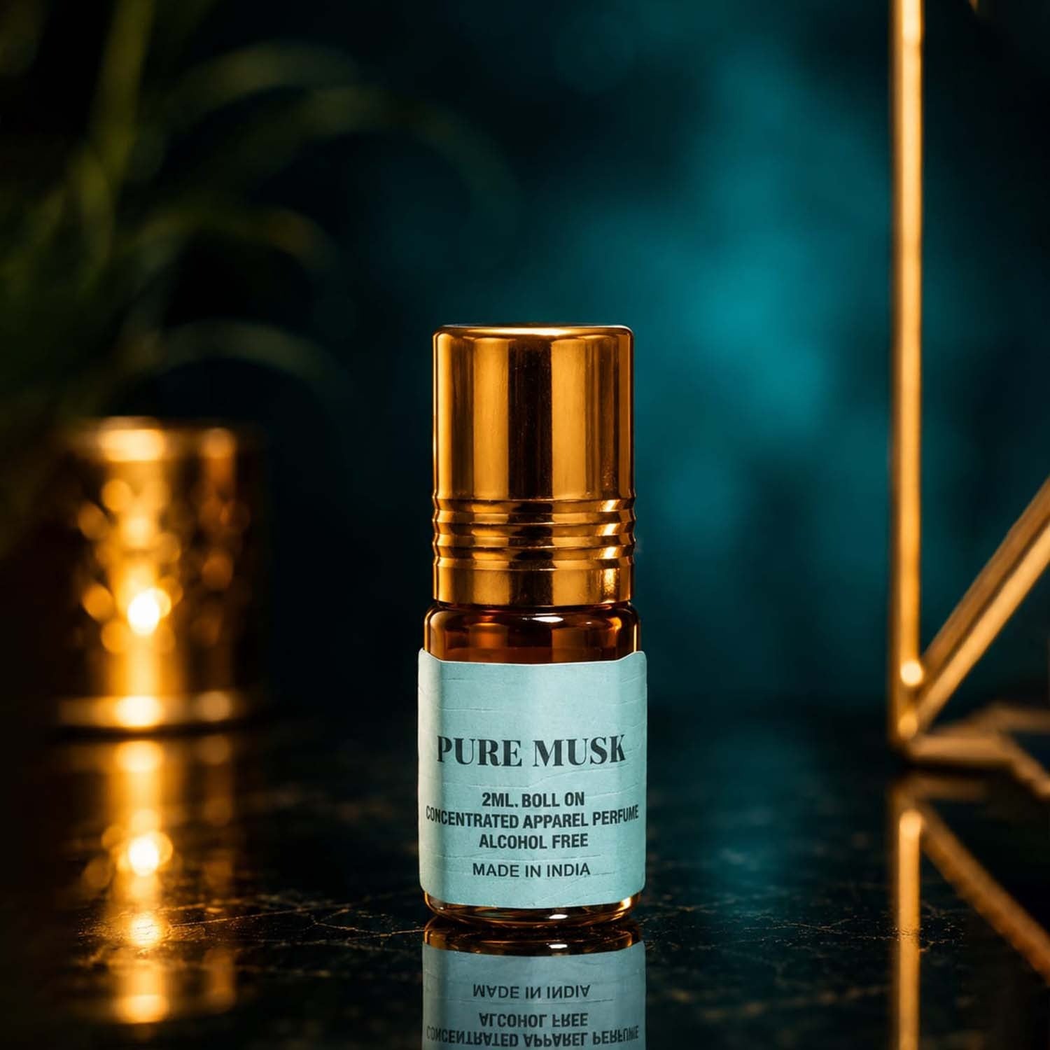 Pure Musk 2ml apparel perfume oil roll-on bottle with a teal label on a reflective surface with a glowing background.