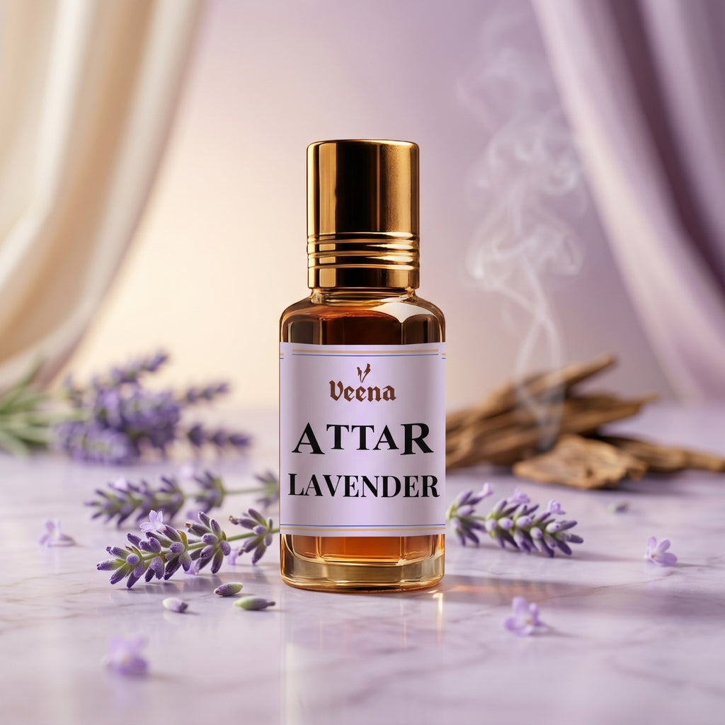 Veena Attar Lavender premium concentrated perfume oil bottle with a gold cap, set on a lavender marble surface with scattered fresh lavender flowers and elegant aromatic wood smoke.