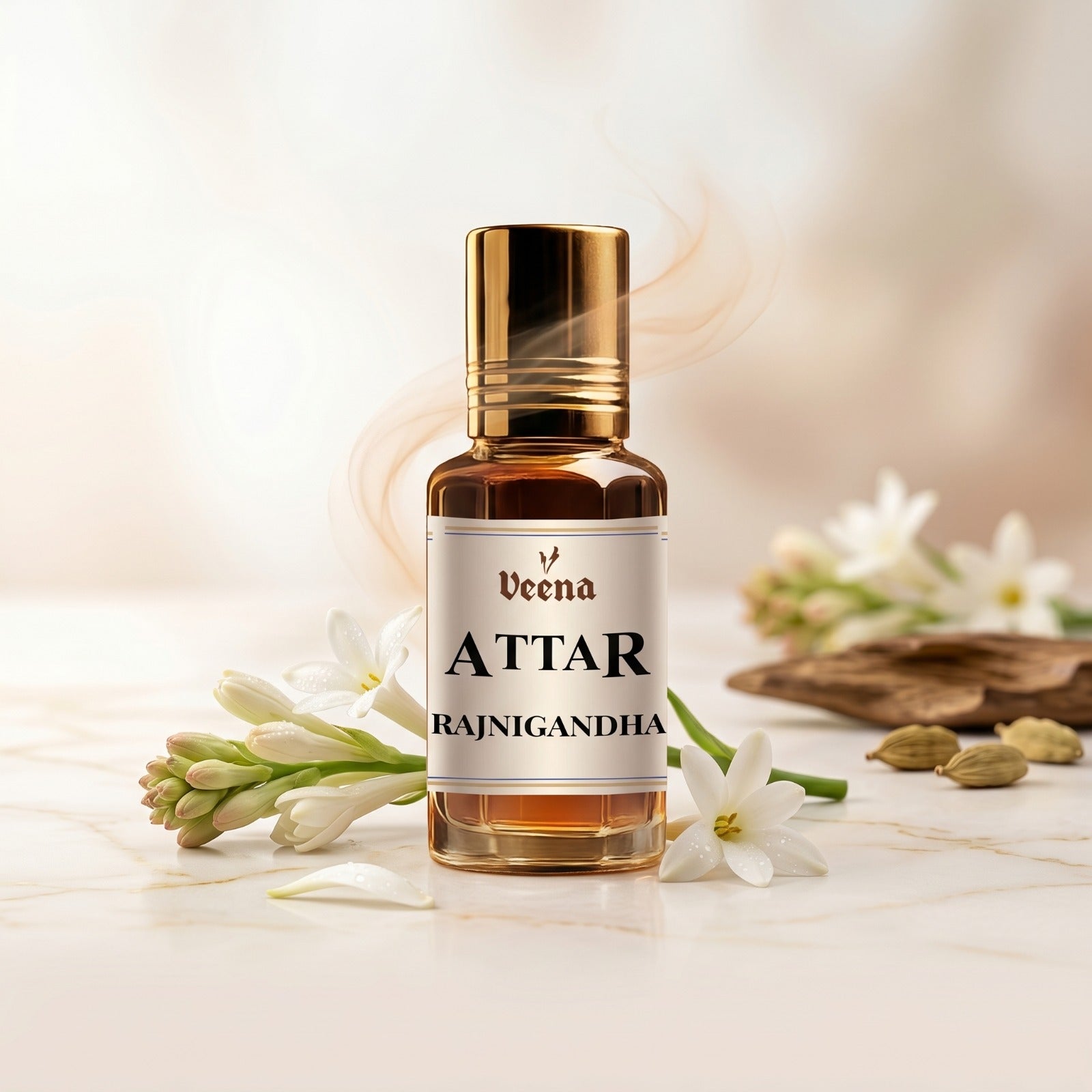 Veena Attar Rajnigandha premium concentrated tuberose perfume oil bottle with a gold cap, set on a polished white surface surrounded by fresh white Rajnigandha flowers, cardamom pods, and elegant curls of aromatic smoke.