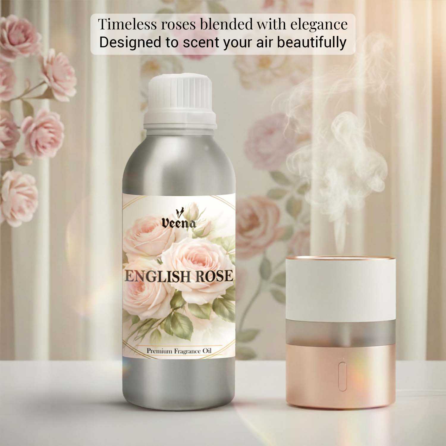 Veena English Rose Premium Fragrance Oil 500g bottle paired with an elegant pink and gold humidifier against a soft floral wallpaper background.