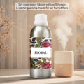 Veena Floral Premium Fragrance Oil aluminum canister showcasing an artistic floral motif label standing next to a cream-colored room humidifier.
